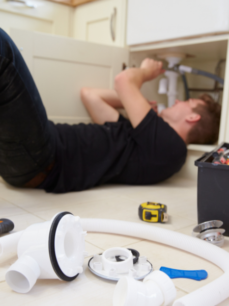 Plumber Fixing Sink