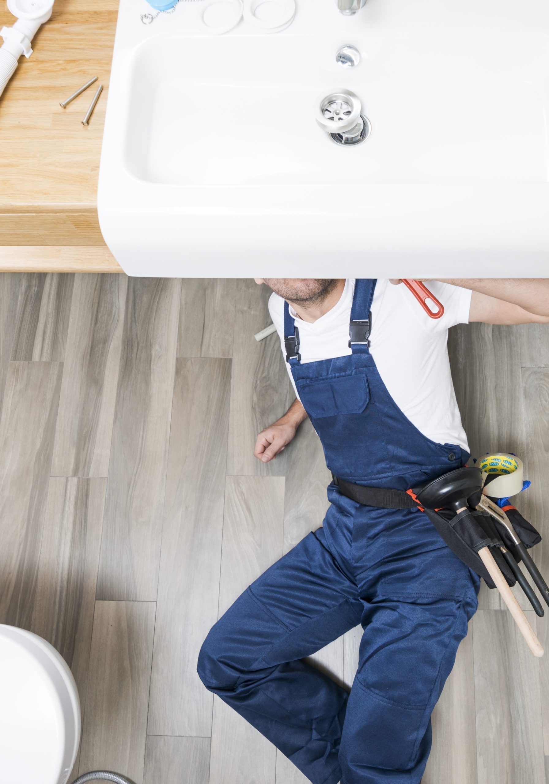 Plumber Under Bathroom Sink